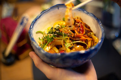 Asian food bowl bowl with shrimp, vegetables and rice noodles