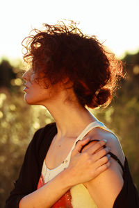 Close-up of young woman smoking outdoors