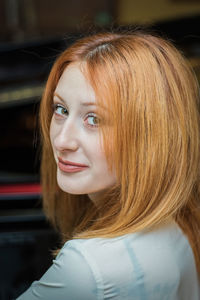 Portrait of beautiful redhead woman at home