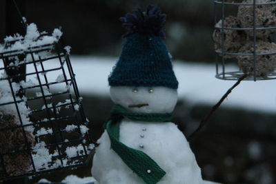 Close-up of snow on wood during winter