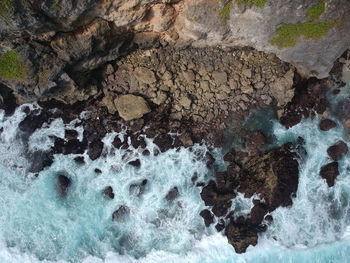 High angle view of rock formation in sea