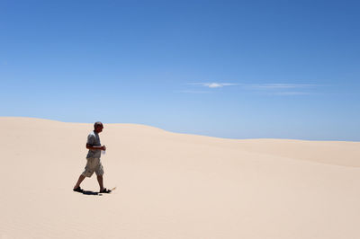 Full length of woman standing on landscape