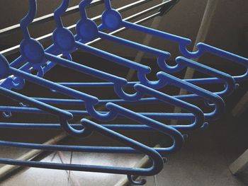 High angle view of coathangers hanging on rack