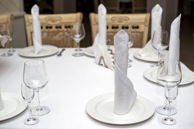 Empty glasses on table in restaurant