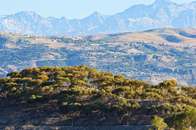 Scenic view of landscape and mountains against sky