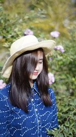 Portrait of young woman in hat