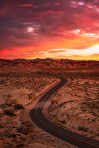 Scenic view of road against sky during sunset