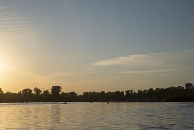 Scenic view of lake against sky during sunset