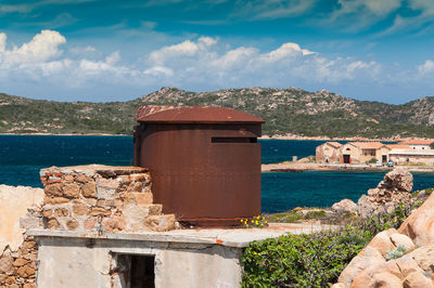 Scenic view of sea and buildings against sky