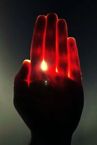 Close-up of red object over black background