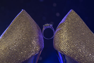 Low angle view of illuminated modern building against blue sky