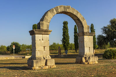 Built structure on field against clear sky