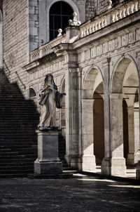 Low angle view of statue of historic building