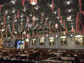 Low angle view of illuminated lights hanging on ceiling