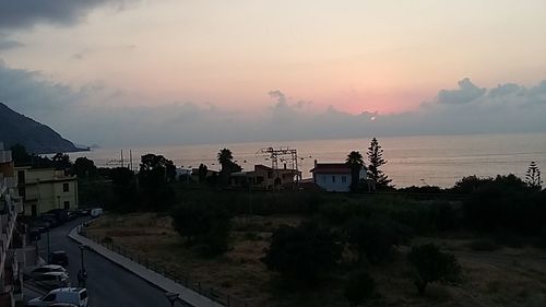 Scenic view of mountains against sky at sunset