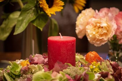 Close-up of red rose on table