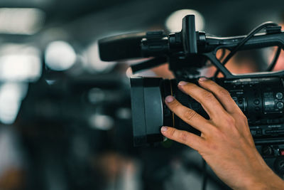 Close-up of hand holding video camera