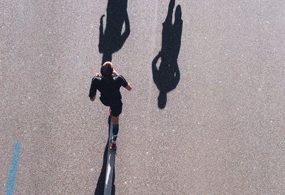 High angle view of people walking on street