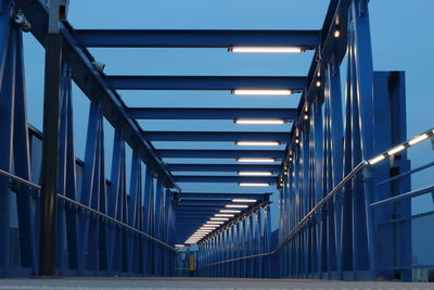 Low angle view of illuminated bridge against sky