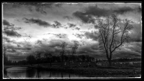 Scenic view of landscape against cloudy sky