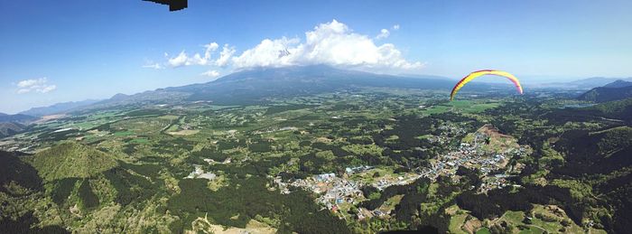 Scenic view of mountains against cloudy sky