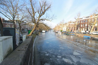 Canal amidst buildings in city