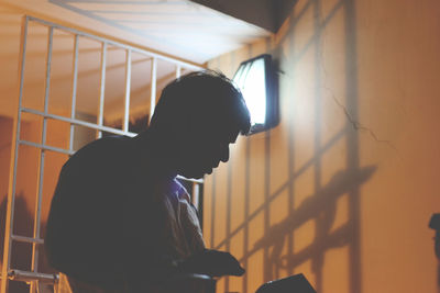 Low angle view of a prisoner in cell