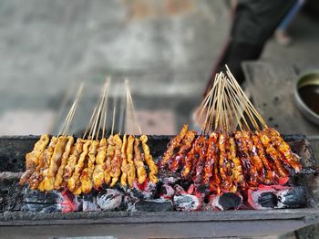 Panoramic shot of meat on barbecue grill