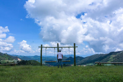 Lifeguard hut on field against sky