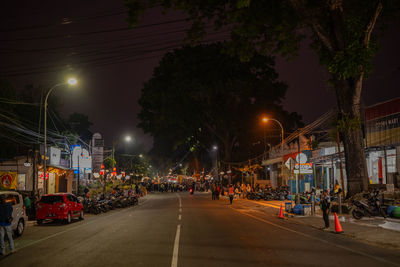 People walking on street at night