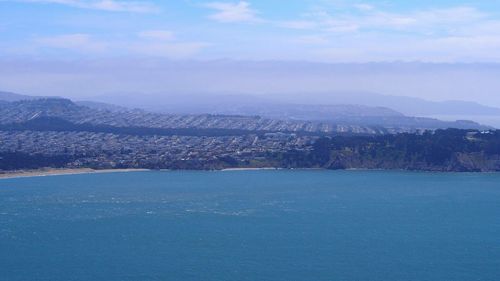 Cityscape with mountain range in background