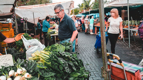 People at market stall