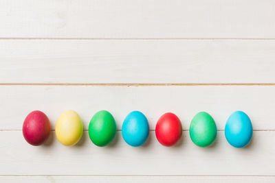 Directly above shot of multi colored easter eggs on table