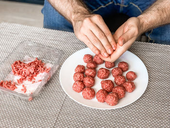 High angle view of person preparing food on table