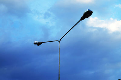 Low angle view of street light against sky