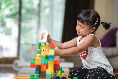 Cute girl playing with toy