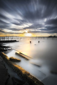 Scenic view of sea against sky at sunset