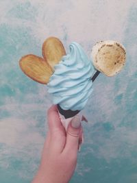 Cropped hand of woman holding ice cream cone