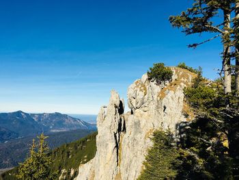 Scenic view of mountains against clear blue sky