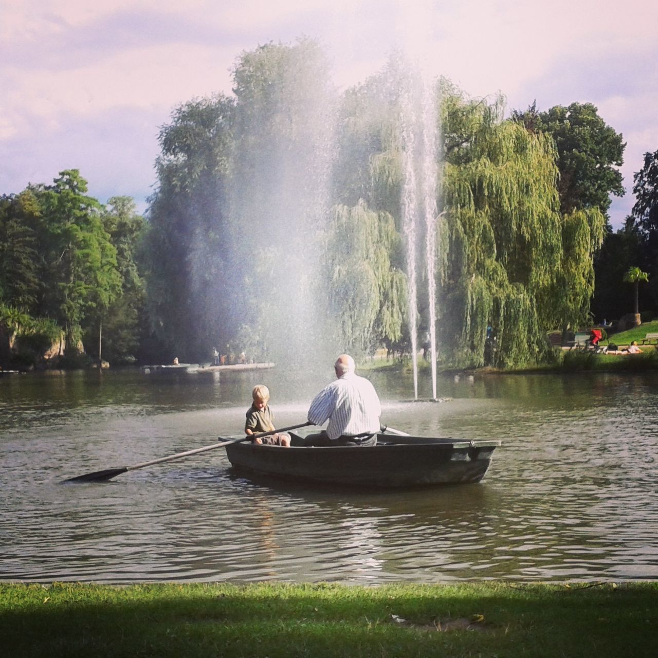 water, nautical vessel, tree, men, transportation, boat, mode of transport, leisure activity, lifestyles, waterfront, sitting, nature, travel, lake, motion, tourist, day, river