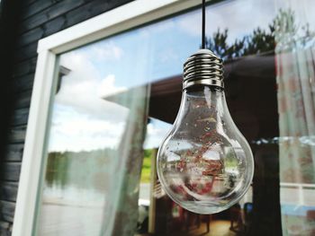 Close-up of light bulb at home