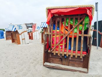 Hooded beach chairs at sandy beach