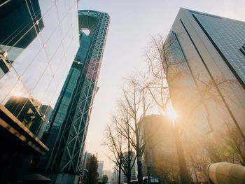 Low angle view of buildings against sky during sunset