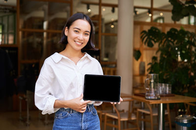 Young woman using mobile phone