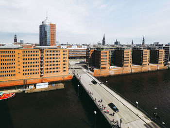 High angle view of bridge over river against buildings in city