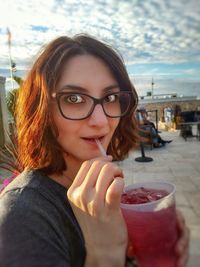 Portrait of young woman wearing sunglasses