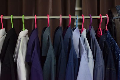 Row of multi colored flags hanging in rack