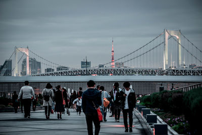 Group of people on suspension bridge