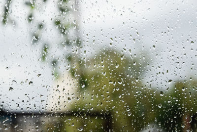 Full frame shot of raindrops on glass window