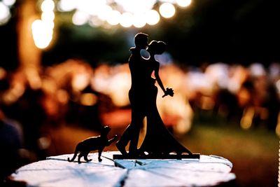 Close-up of female sculpture on table
